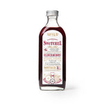 Bottle of Switchel with a white label on a white background.