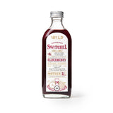 Bottle of Switchel with a white label on a white background.