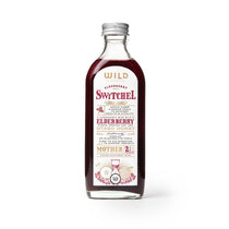 Bottle of Switchel with a white label on a white background.