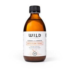An amber glass bottle of Anti-Flam Tonic with a black cap and white label, set against a plain white background.