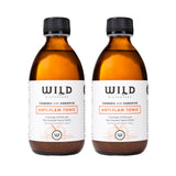 Two amber glass bottles of Anti-Flam Tonic with black caps and white labels, shown side by side on a white background.