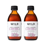 Two Chest Tonic bottles with black caps and white labels, shown side by side on a white background.
