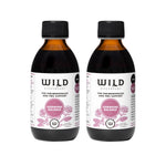 Two amber glass bottles Hormone Balance black caps and white labels featuring pink floral graphics, shown on a plain white background.