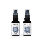 Two amber spray bottles of Throat Spray with white labels and blue accents, shown side-by-side on a white background.